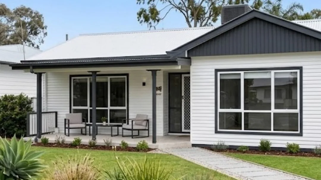 A renovated brick house with a landscaped front garden, from the Charlie Property website