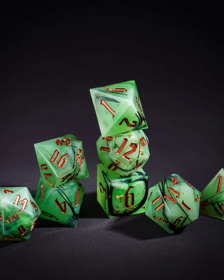 Only Crits green resin dice set stacked on a dark background
